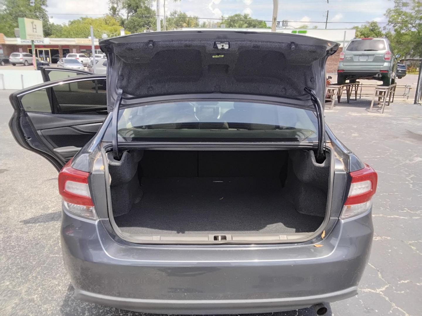 2017 GRAY /Grey Subaru Impreza 2.0i Premium CVT 4-Door (4S3GKAB65H3) with an 2.0L H4 DOHC 16V engine, CVT transmission, located at 6112 N Florida Avenue, Tampa, FL, 33604, (888) 521-5131, 27.954929, -82.459534 - $499 down plus tax & tag. - Photo#4
