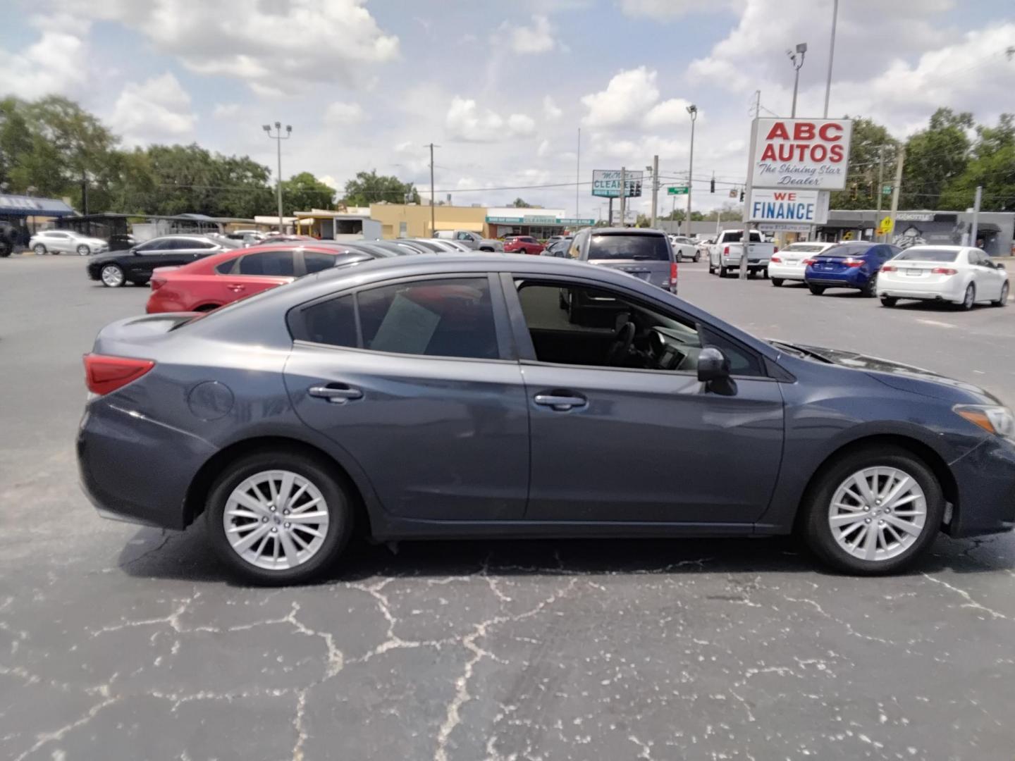 2017 GRAY /Grey Subaru Impreza 2.0i Premium CVT 4-Door (4S3GKAB65H3) with an 2.0L H4 DOHC 16V engine, CVT transmission, located at 6112 N Florida Avenue, Tampa, FL, 33604, (888) 521-5131, 27.954929, -82.459534 - $499 down plus tax & tag. - Photo#2
