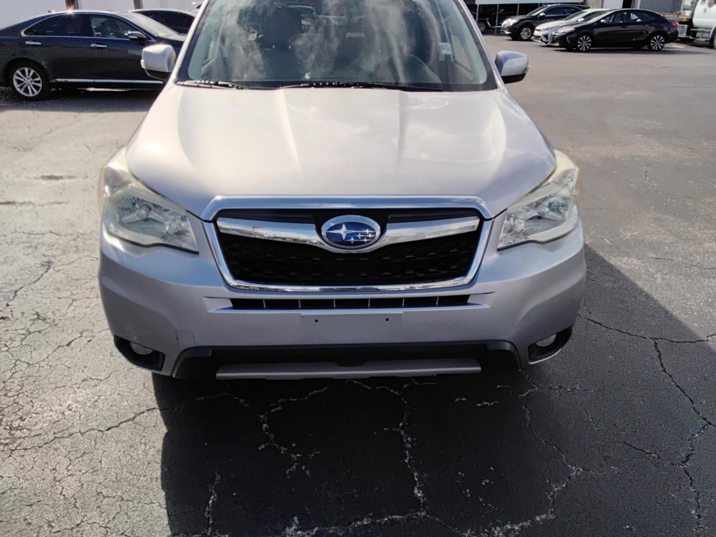 2014 SILVER /Beige Subaru Forester (JF2SJAPC8EH) , located at 6112 N Florida Avenue, Tampa, FL, 33604, (888) 521-5131, 27.954929, -82.459534 - 499$ DOWN PLUS TAX & TAG. - Photo#1