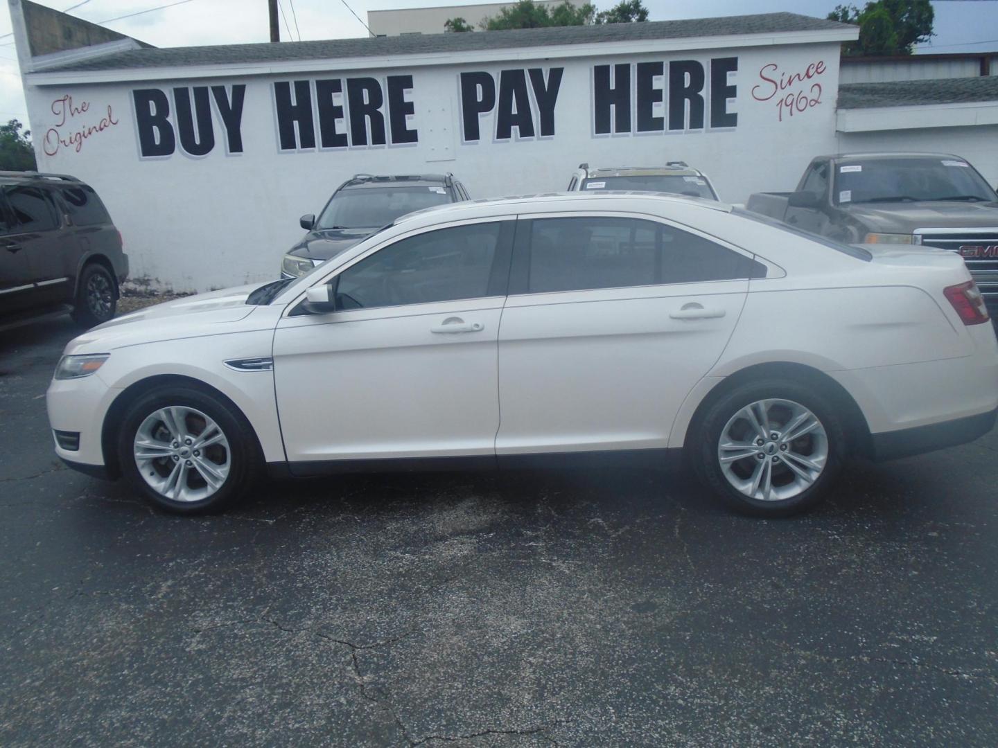 2017 White /Beige Ford Taurus (1FAHP2E8XHG) , located at 6112 N Florida Avenue, Tampa, FL, 33604, (888) 521-5131, 27.954929, -82.459534 - 499$ DOWN PLUS TAX & TAG. - Photo#0