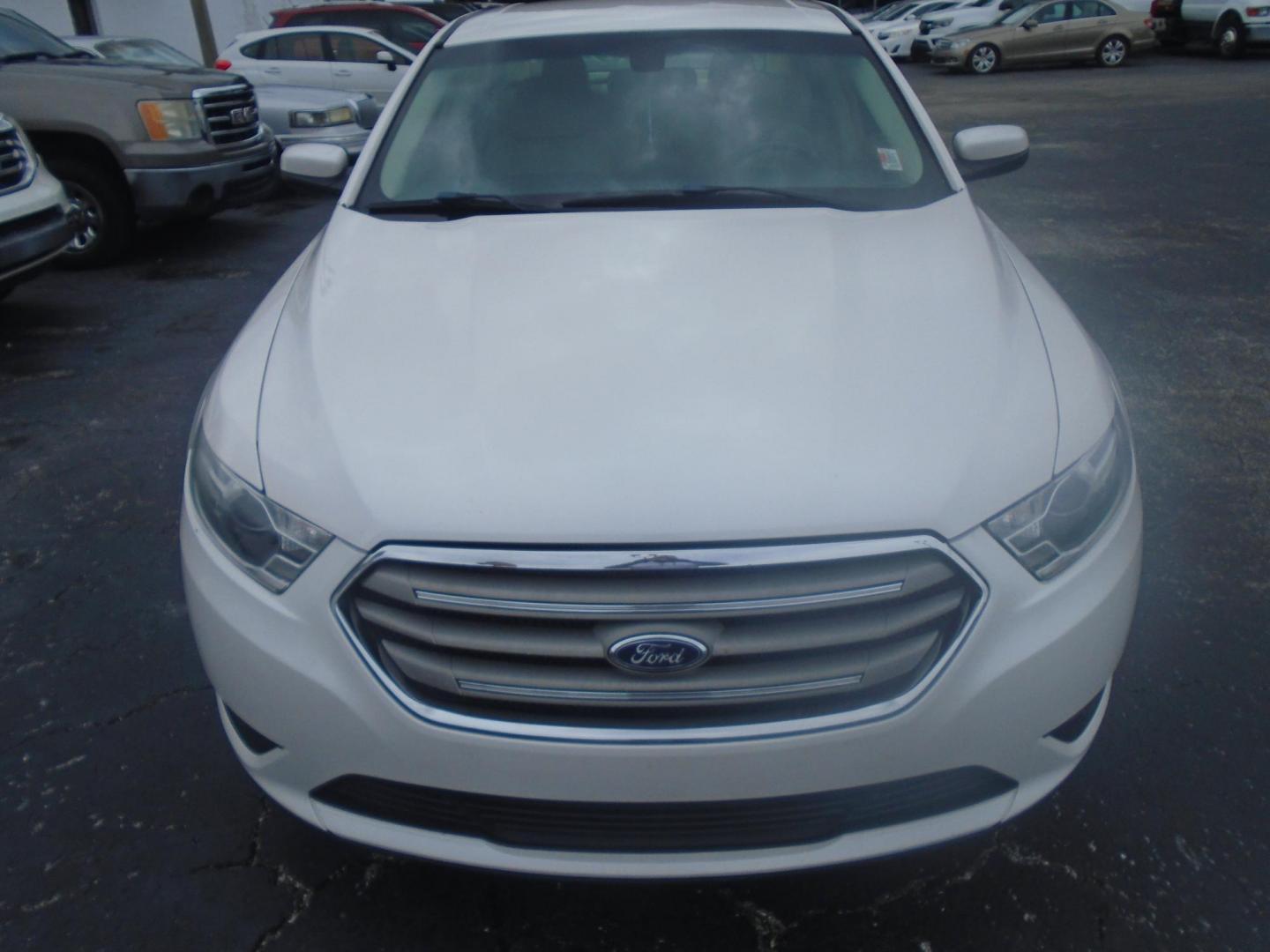 2017 White /Beige Ford Taurus (1FAHP2E8XHG) , located at 6112 N Florida Avenue, Tampa, FL, 33604, (888) 521-5131, 27.954929, -82.459534 - 499$ DOWN PLUS TAX & TAG. - Photo#2