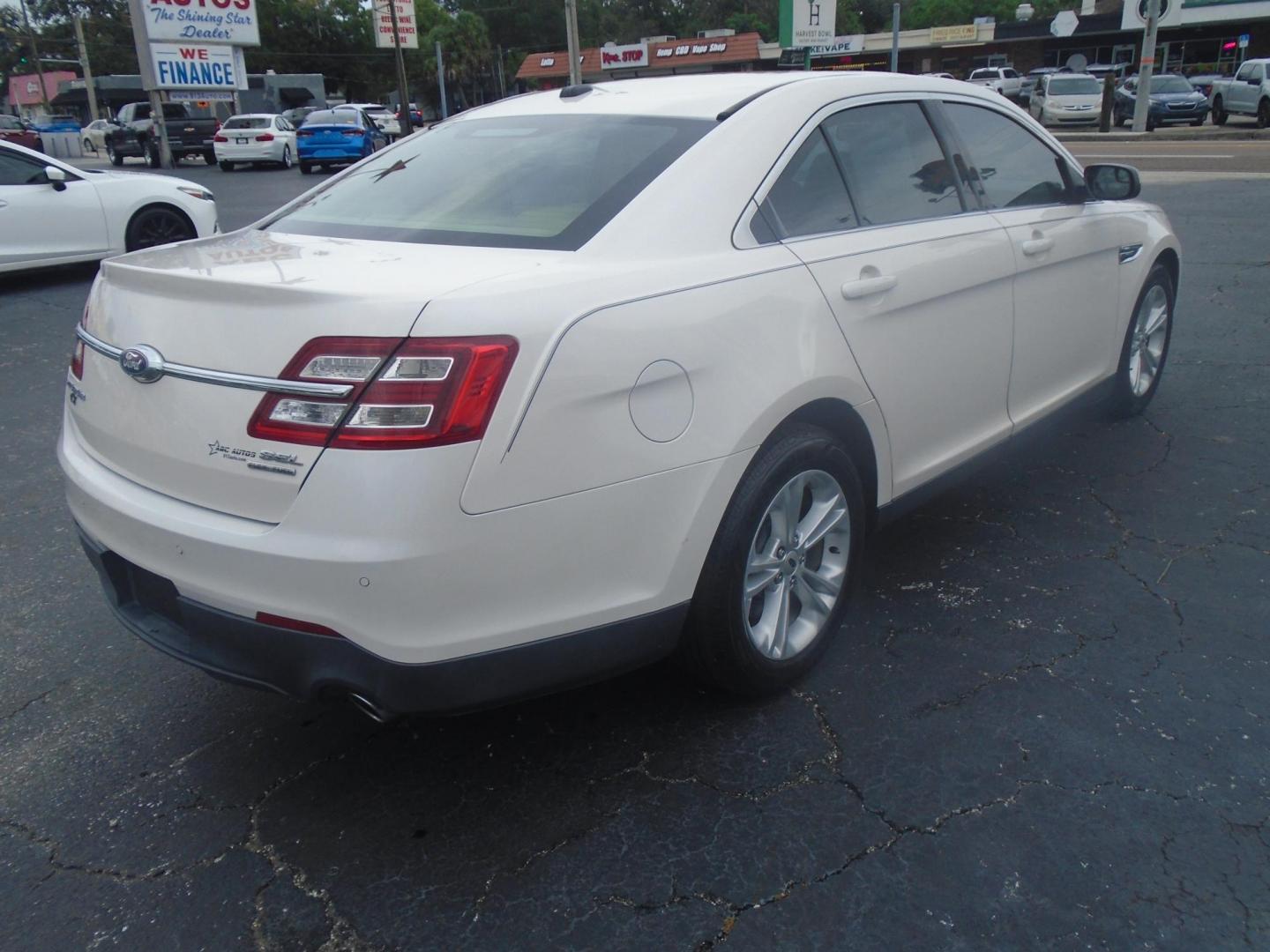 2017 White /Beige Ford Taurus (1FAHP2E8XHG) , located at 6112 N Florida Avenue, Tampa, FL, 33604, (888) 521-5131, 27.954929, -82.459534 - 499$ DOWN PLUS TAX & TAG. - Photo#4