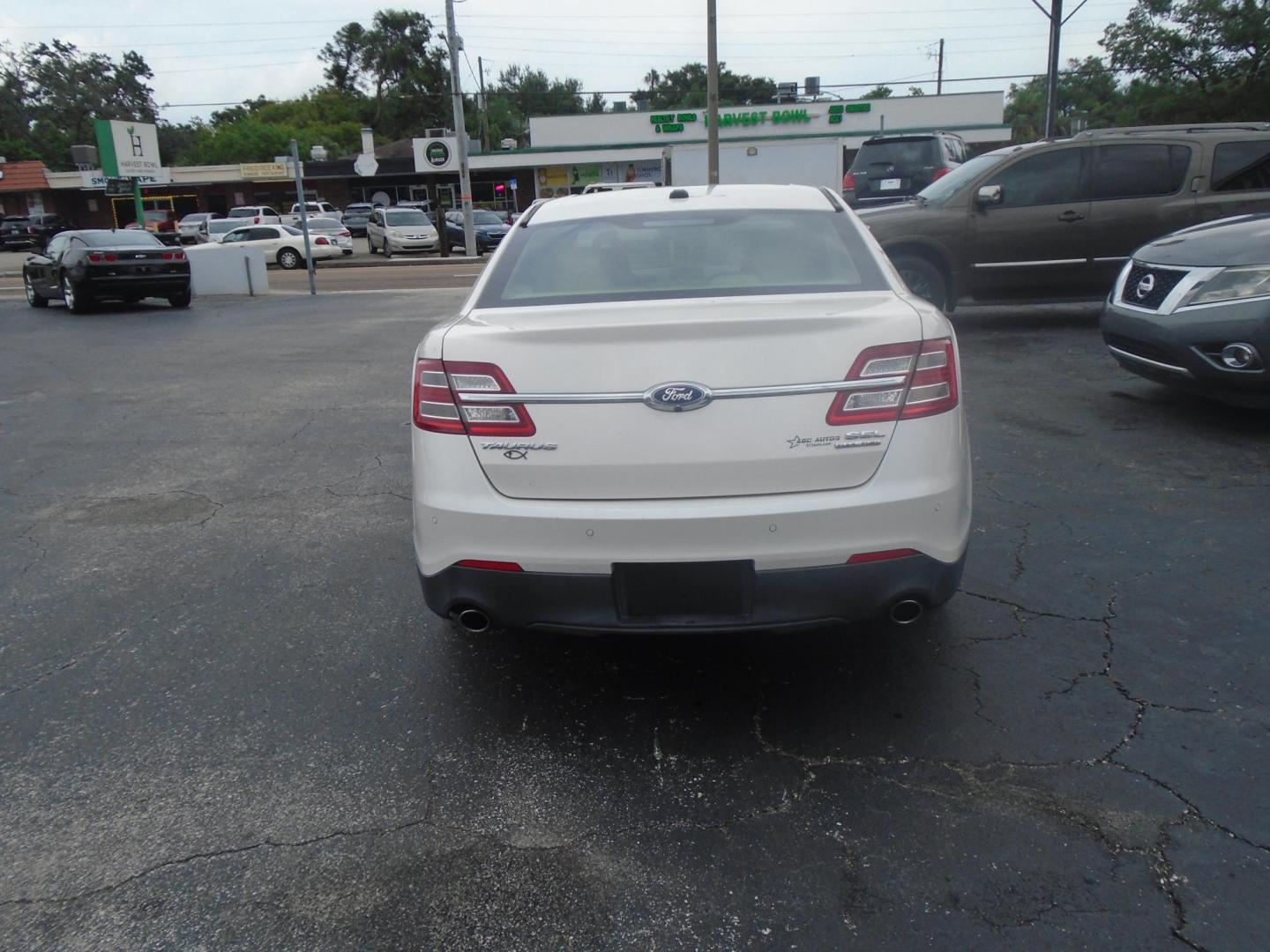 2017 White /Beige Ford Taurus (1FAHP2E8XHG) , located at 6112 N Florida Avenue, Tampa, FL, 33604, (888) 521-5131, 27.954929, -82.459534 - 499$ DOWN PLUS TAX & TAG. - Photo#5