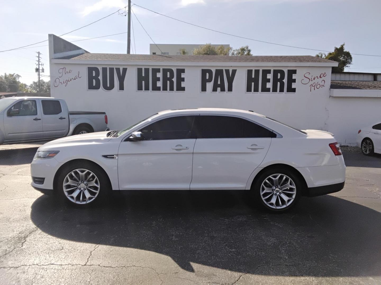 2017 White /Beige Ford Taurus (1FAHP2F83HG) , located at 6112 N Florida Avenue, Tampa, FL, 33604, (888) 521-5131, 27.954929, -82.459534 - $499 DOWN PLUS TAX & TAG. - Photo#0