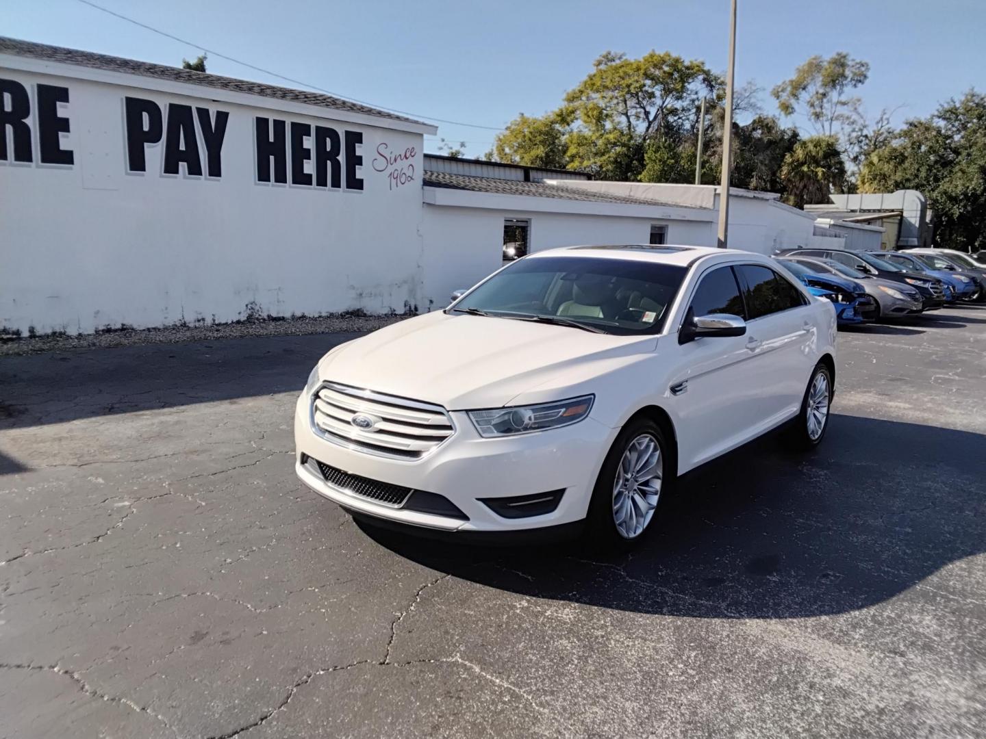 2017 White /Beige Ford Taurus (1FAHP2F83HG) , located at 6112 N Florida Avenue, Tampa, FL, 33604, (888) 521-5131, 27.954929, -82.459534 - $499 DOWN PLUS TAX & TAG. - Photo#1