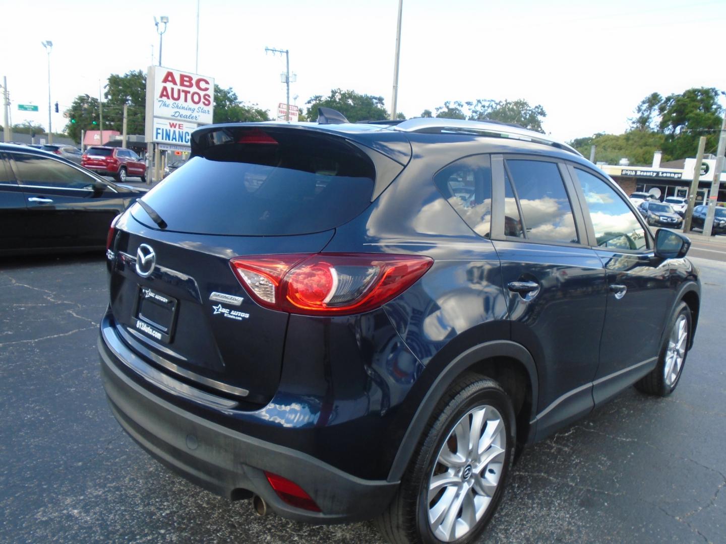 2014 Mazda CX-5 (JM3KE2DY8E0) , located at 6112 N Florida Avenue, Tampa, FL, 33604, (888) 521-5131, 27.954929, -82.459534 - Photo#7