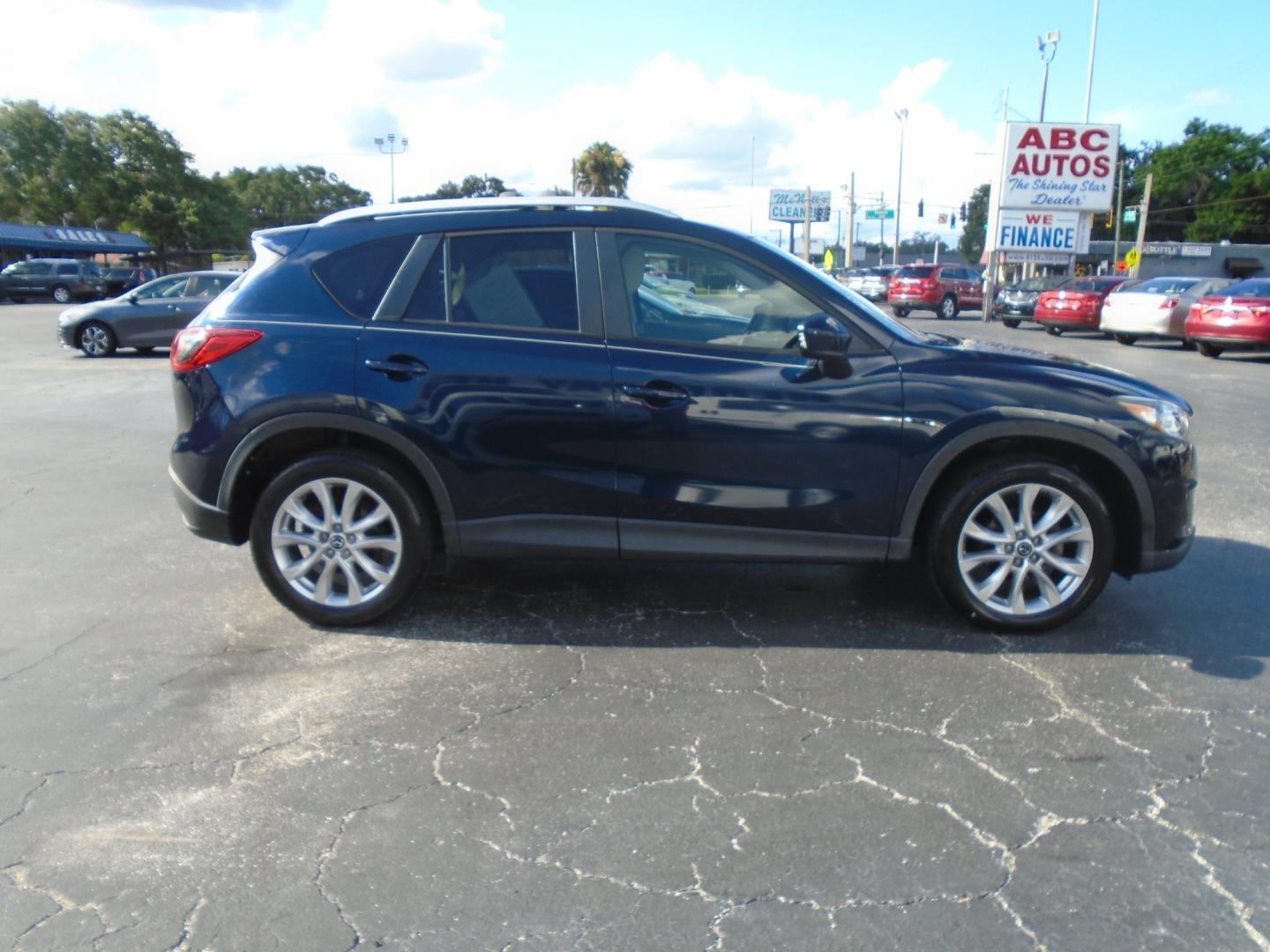 2014 Mazda CX-5 (JM3KE2DY8E0) , located at 6112 N Florida Avenue, Tampa, FL, 33604, (888) 521-5131, 27.954929, -82.459534 - Photo#2