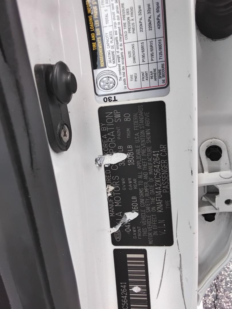 2012 White /Beige Kia Forte (KNAFU4A2XC5) , located at 6112 N Florida Avenue, Tampa, FL, 33604, (888) 521-5131, 27.954929, -82.459534 - $499 down plus tax & tag.- Photo#20