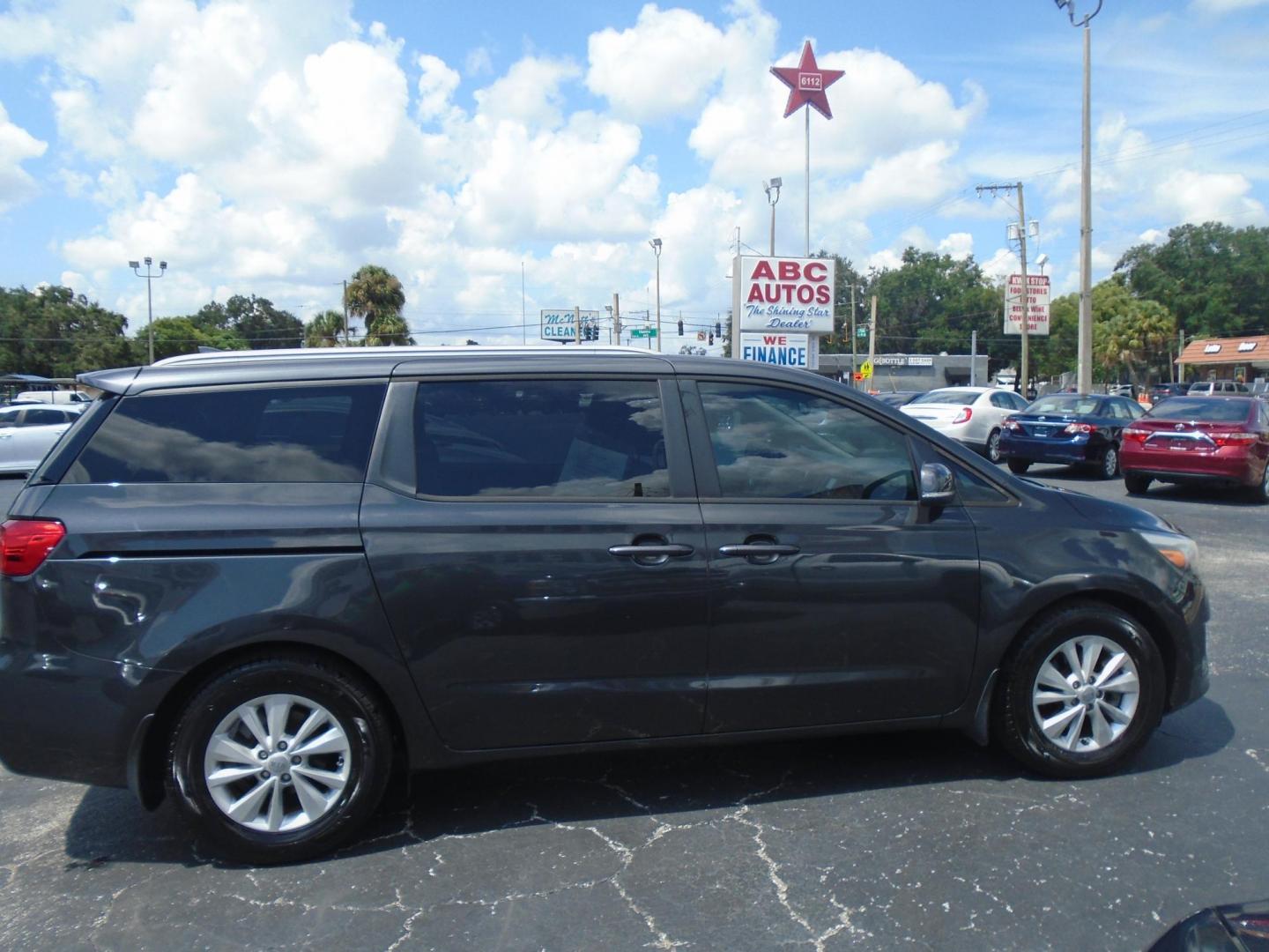 2016 Kia Sedona LX (KNDMB5C14G6) with an 3.3L V6 DOHC 24V engine, 6-Speed Automatic transmission, located at 6112 N Florida Avenue, Tampa, FL, 33604, (888) 521-5131, 27.954929, -82.459534 - Photo#1