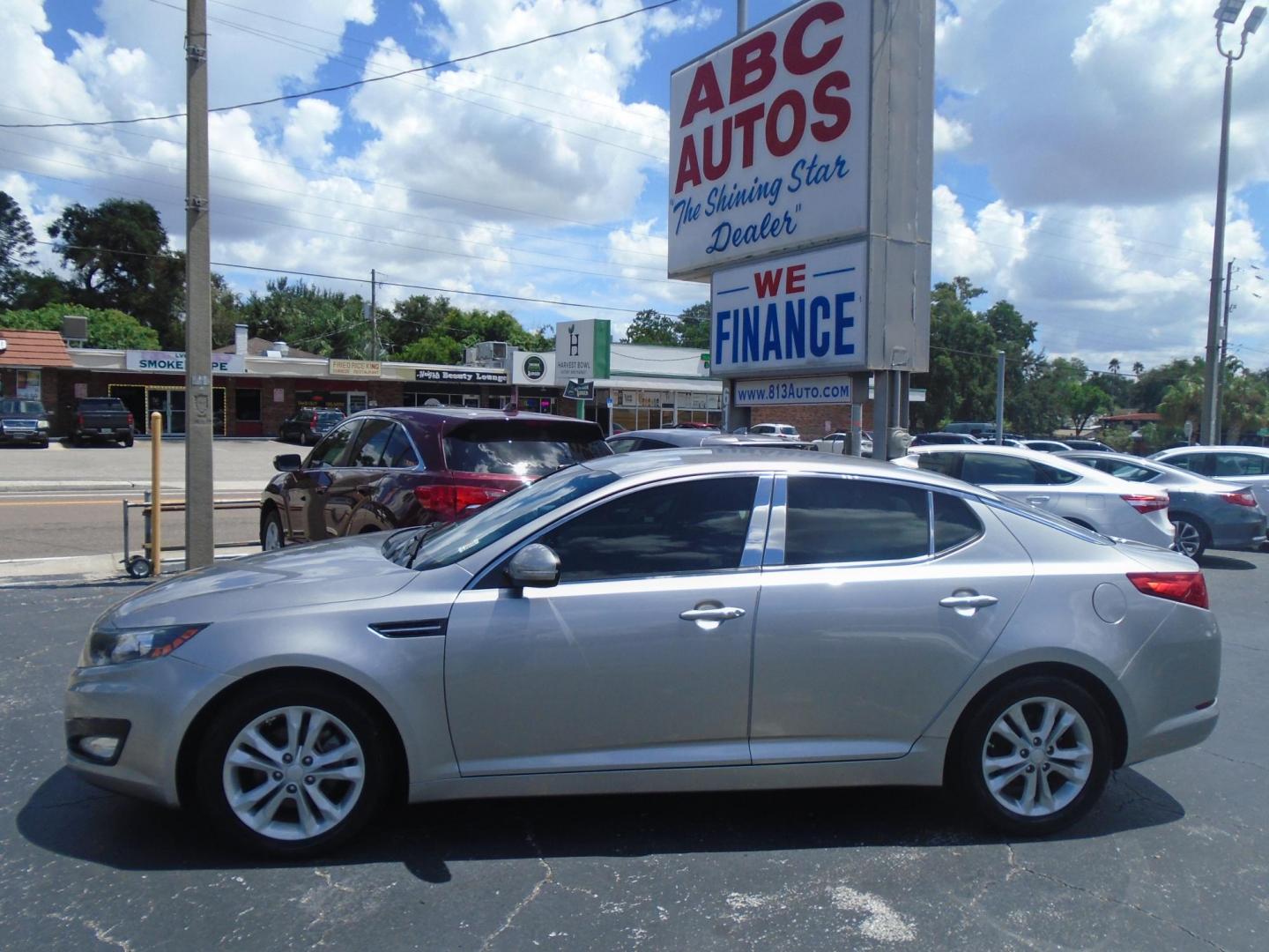 2012 Kia Optima EX (5XXGN4A75CG) with an 2.4L L4 DOHC 16V engine, 6-Speed Automatic transmission, located at 6112 N Florida Avenue, Tampa, FL, 33604, (888) 521-5131, 27.954929, -82.459534 - Photo#0