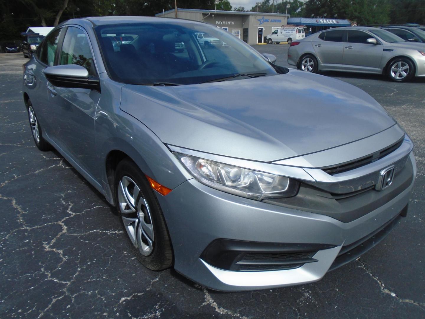 2016 Honda Civic LX Sedan CVT (19XFC2F50GE) with an 2.0L L4 DOHC 16V engine, CVT transmission, located at 6112 N Florida Avenue, Tampa, FL, 33604, (888) 521-5131, 27.954929, -82.459534 - Photo#3