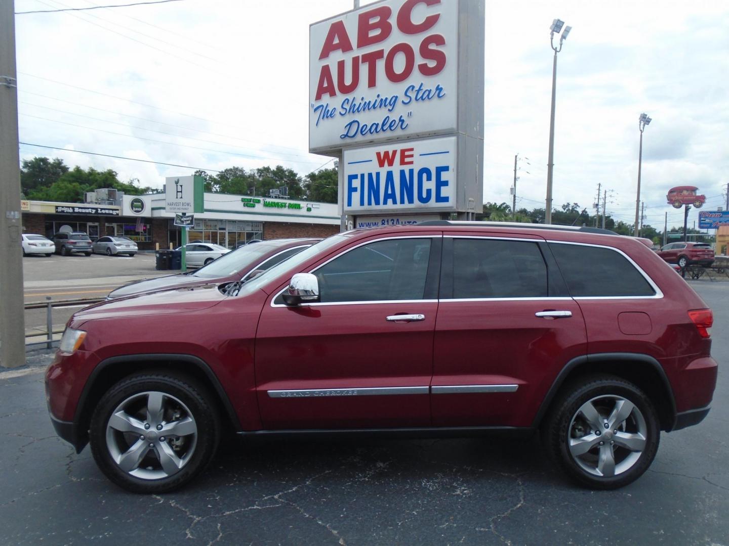 2013 Jeep Grand Cherokee Overland 4WD (1C4RJFCG7DC) with an 3.6L V6 DOHC 24V engine, 5-Speed Automatic transmission, located at 6112 N Florida Avenue, Tampa, FL, 33604, (888) 521-5131, 27.954929, -82.459534 - Photo#0