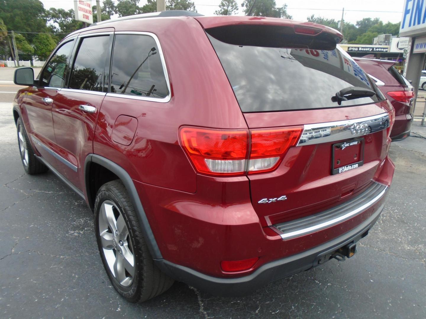 2013 Jeep Grand Cherokee Overland 4WD (1C4RJFCG7DC) with an 3.6L V6 DOHC 24V engine, 5-Speed Automatic transmission, located at 6112 N Florida Avenue, Tampa, FL, 33604, (888) 521-5131, 27.954929, -82.459534 - Photo#4