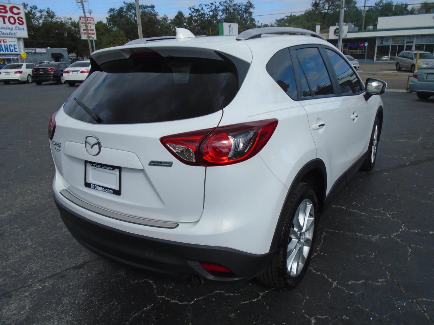 2014 Mazda CX-5 Grand Touring (JM3KE2DY9E0) with an 2.5L L4 DOHC 16V engine, 6-Speed Automatic transmission, located at 6112 N Florida Avenue, Tampa, FL, 33604, (888) 521-5131, 27.954929, -82.459534 - Photo#3