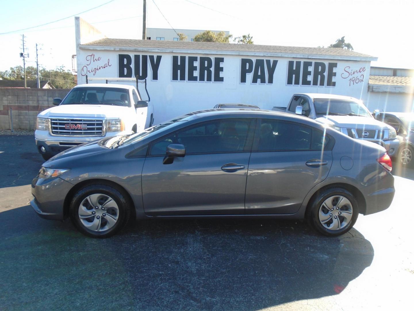 2014 Honda Civic LX Sedan CVT (19XFB2F56EE) with an 1.8L L4 SOHC 16V engine, Continuously Variable Transmission transmission, located at 6112 N Florida Avenue, Tampa, FL, 33604, (888) 521-5131, 27.954929, -82.459534 - Photo#0