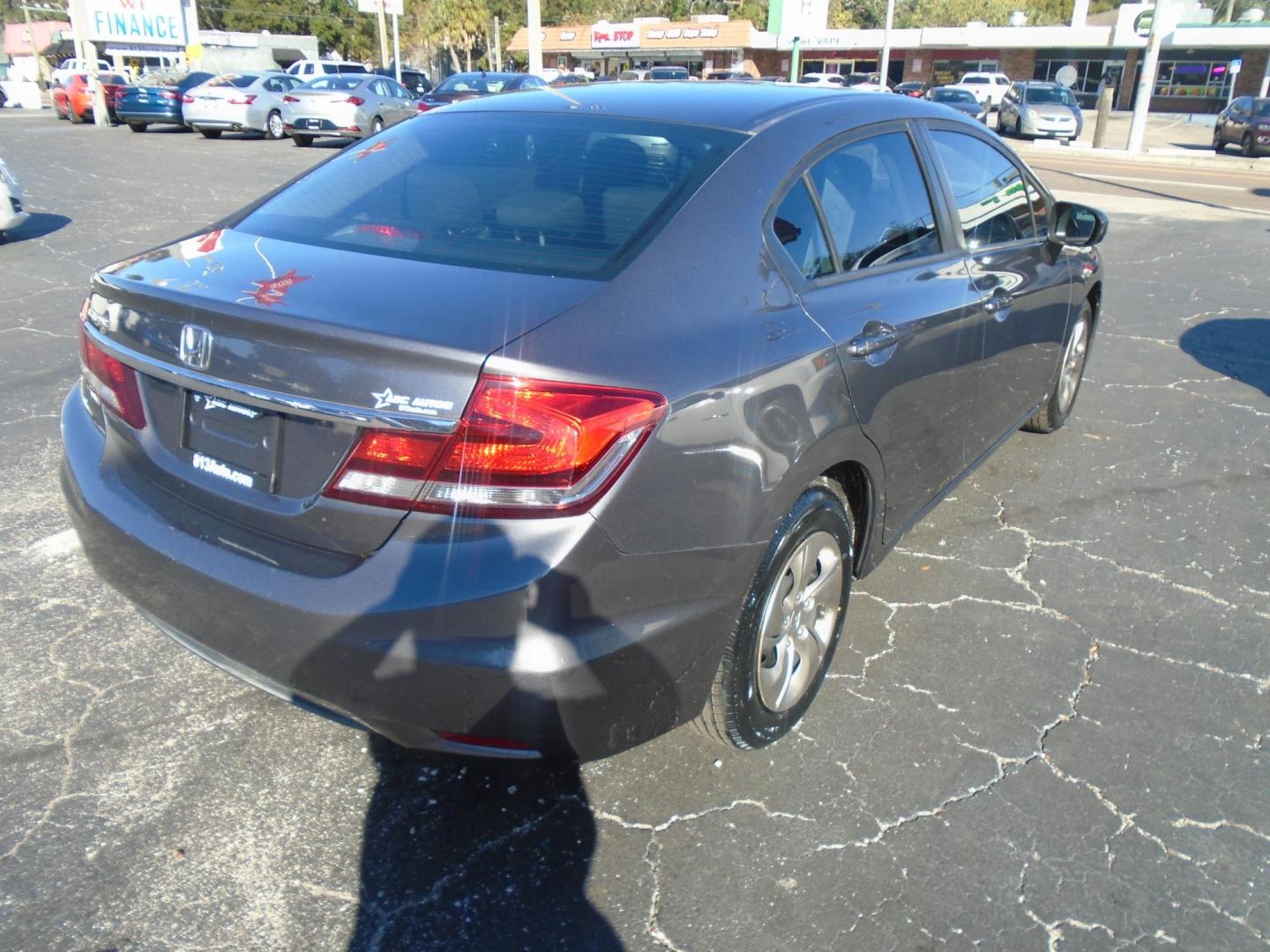 2014 Honda Civic LX Sedan CVT (19XFB2F56EE) with an 1.8L L4 SOHC 16V engine, Continuously Variable Transmission transmission, located at 6112 N Florida Avenue, Tampa, FL, 33604, (888) 521-5131, 27.954929, -82.459534 - Photo#3