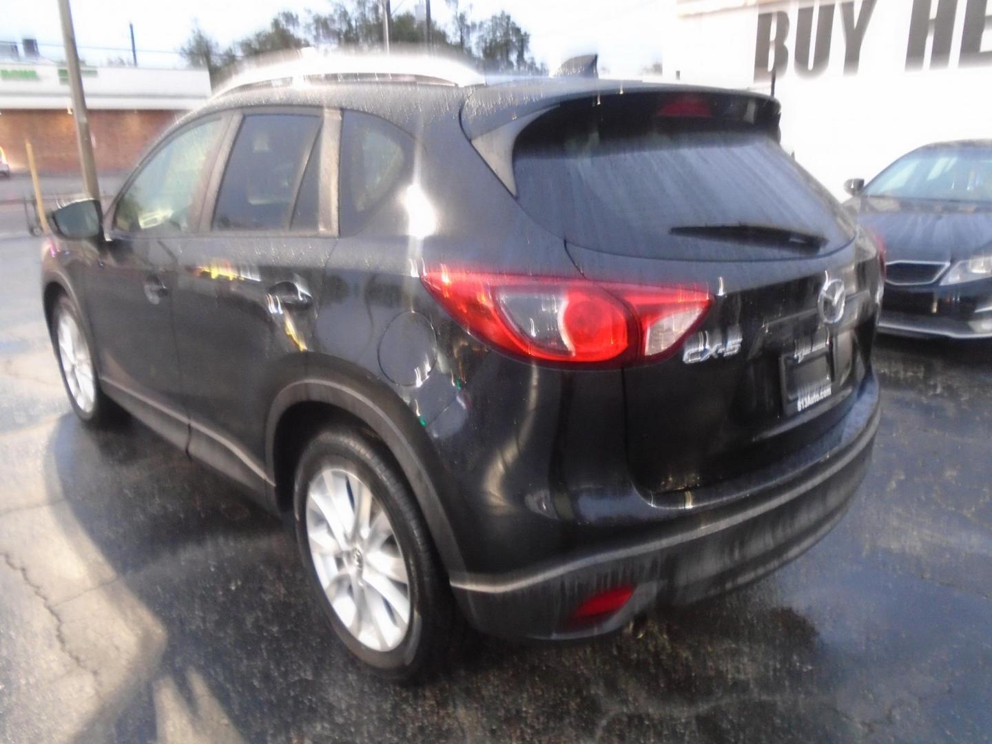 2014 Mazda CX-5 Grand Touring (JM3KE2DY0E0) with an 2.5L L4 DOHC 16V engine, 6-Speed Automatic transmission, located at 6112 N Florida Avenue, Tampa, FL, 33604, (888) 521-5131, 27.954929, -82.459534 - Photo#1