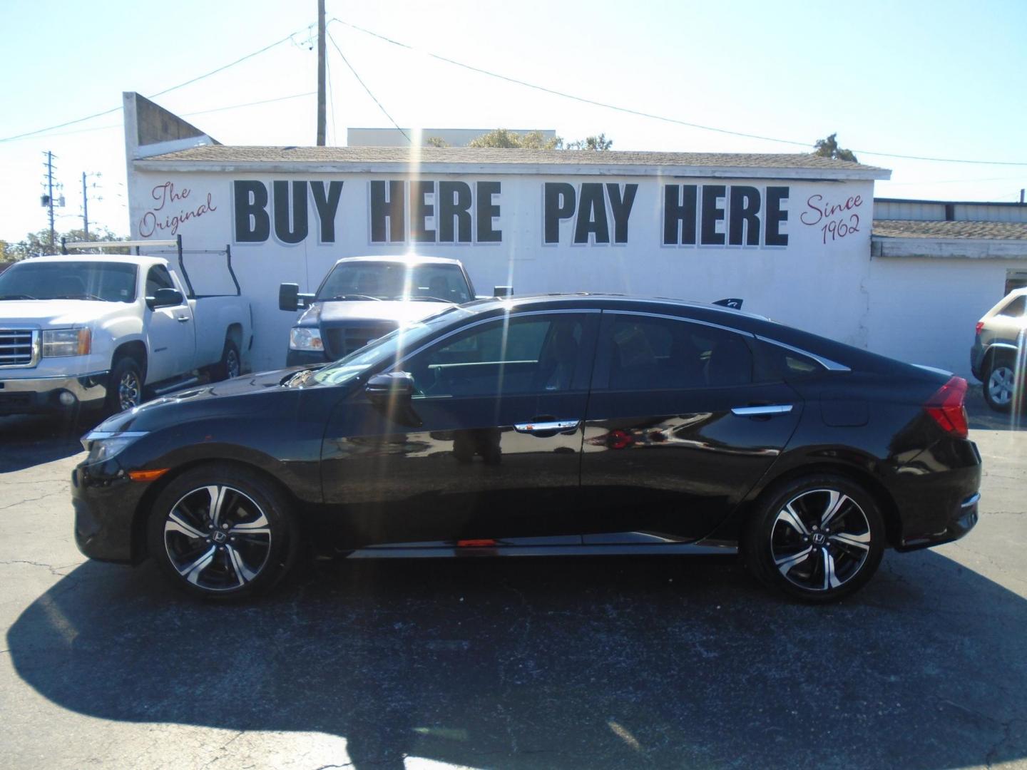 2016 Honda Civic Touring Sedan CVT (19XFC1F94GE) with an 1.5L L4 DOHC 16V TURBO engine, CVT transmission, located at 6112 N Florida Avenue, Tampa, FL, 33604, (888) 521-5131, 27.954929, -82.459534 - Photo#0