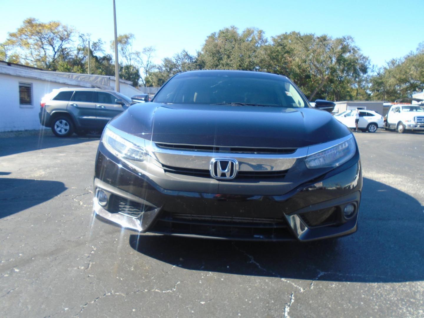 2016 Honda Civic Touring Sedan CVT (19XFC1F94GE) with an 1.5L L4 DOHC 16V TURBO engine, CVT transmission, located at 6112 N Florida Avenue, Tampa, FL, 33604, (888) 521-5131, 27.954929, -82.459534 - Photo#1