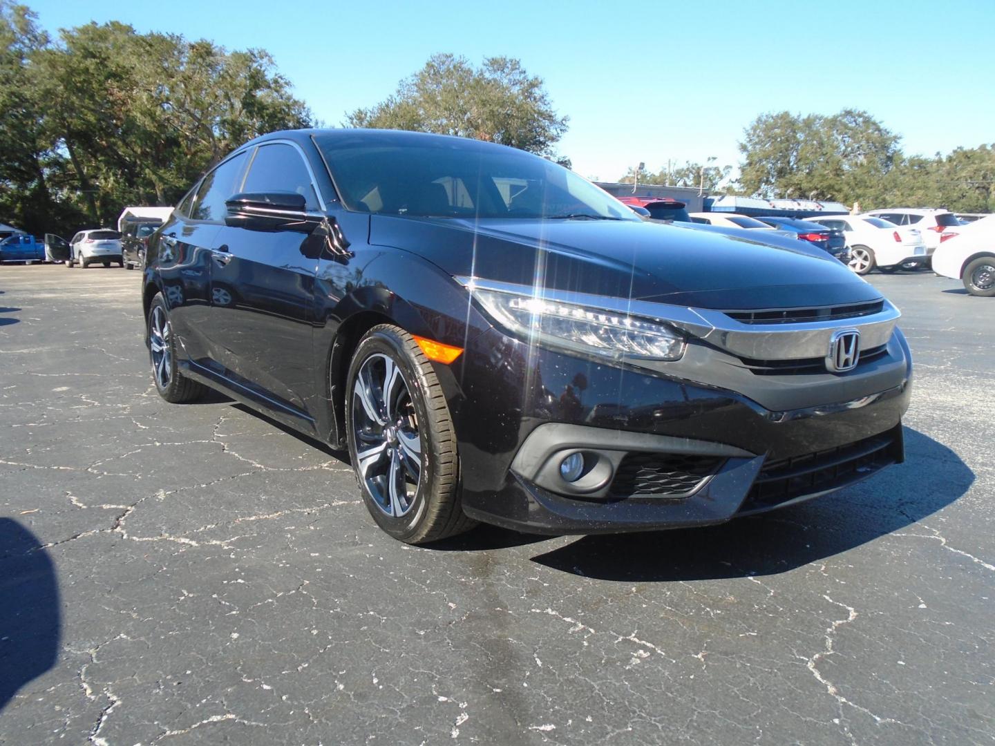 2016 Honda Civic Touring Sedan CVT (19XFC1F94GE) with an 1.5L L4 DOHC 16V TURBO engine, CVT transmission, located at 6112 N Florida Avenue, Tampa, FL, 33604, (888) 521-5131, 27.954929, -82.459534 - Photo#3