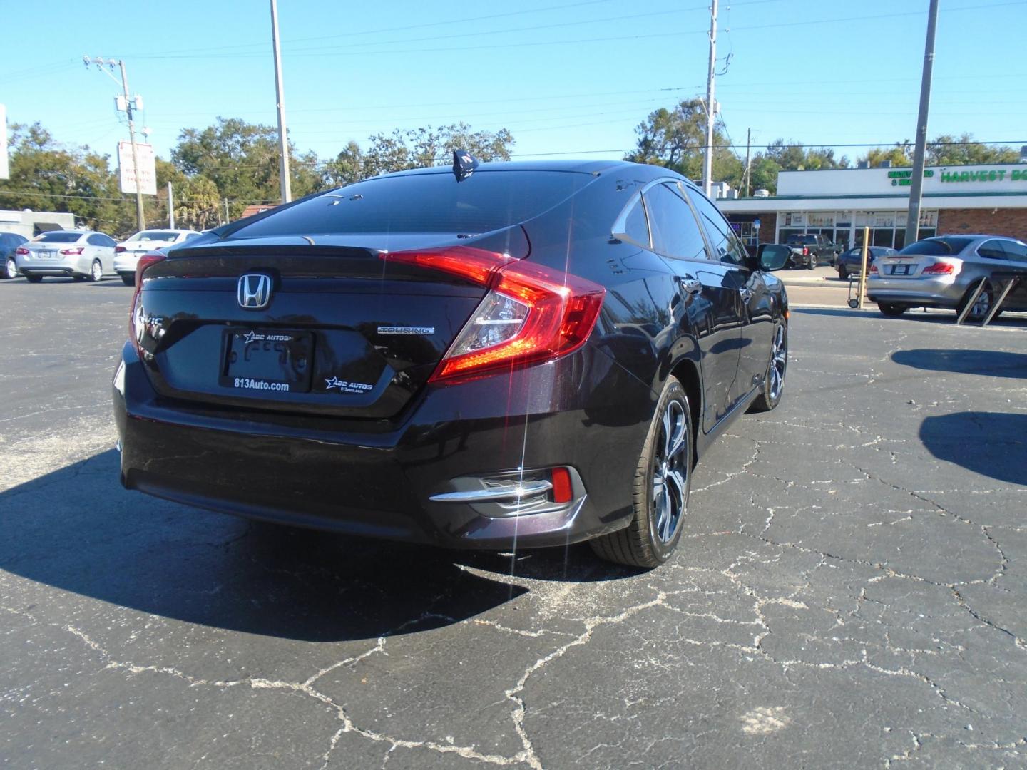 2016 Honda Civic Touring Sedan CVT (19XFC1F94GE) with an 1.5L L4 DOHC 16V TURBO engine, CVT transmission, located at 6112 N Florida Avenue, Tampa, FL, 33604, (888) 521-5131, 27.954929, -82.459534 - Photo#4