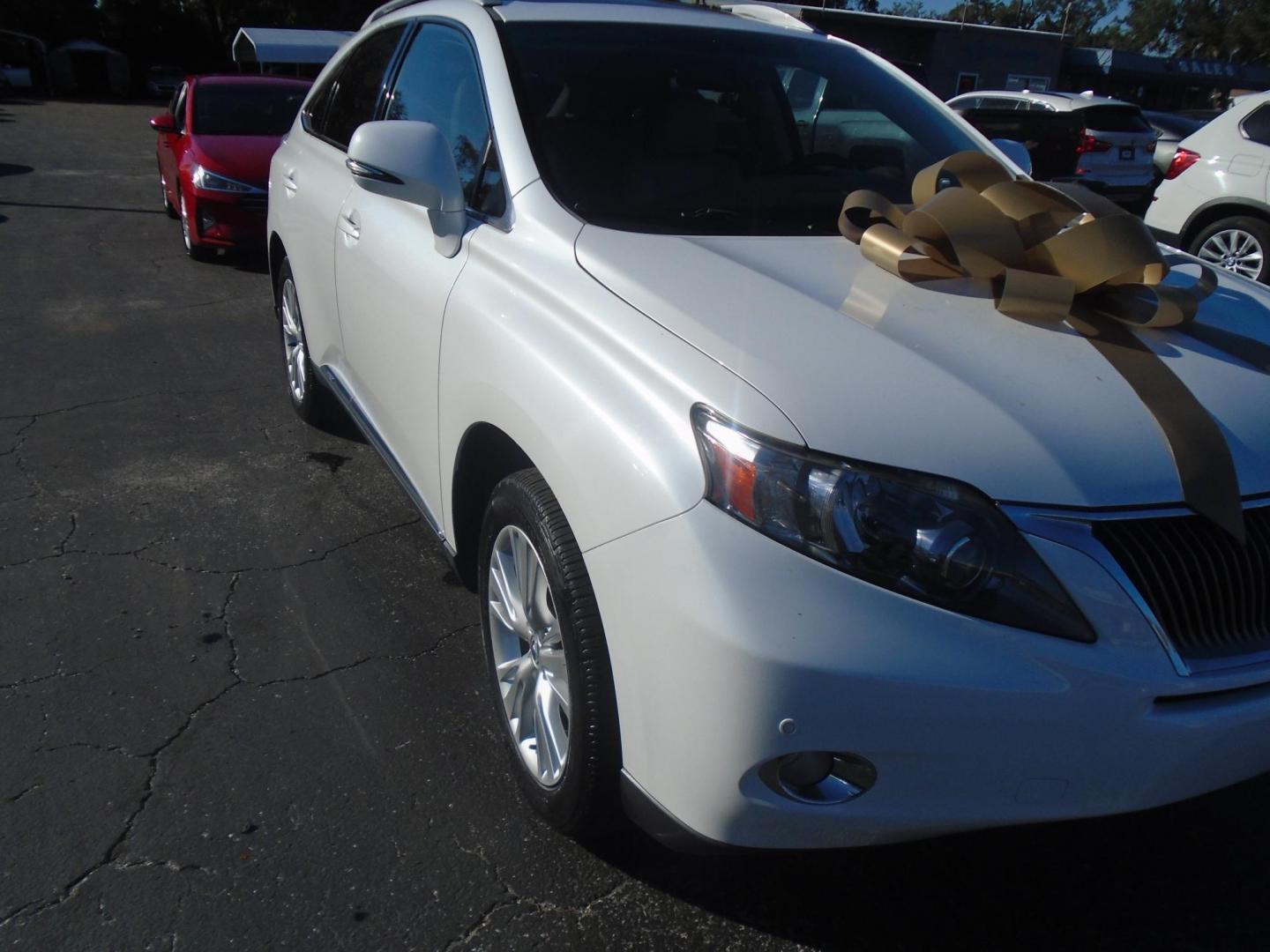 2011 Lexus RX 450h FWD (JTJZB1BA7B2) with an 3.5L V6 DOHC 24V HYBRID engine, 5-Speed Automatic transmission, located at 6112 N Florida Avenue, Tampa, FL, 33604, (888) 521-5131, 27.954929, -82.459534 - Photo#4