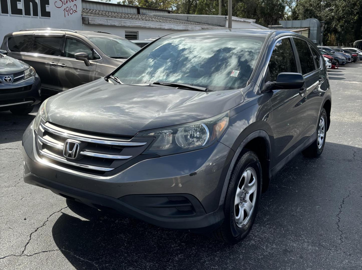 2014 Honda CR-V LX 2WD 5-Speed AT (3CZRM3H31EG) with an 2.4L L4 DOHC 16V engine, 5-Speed Automatic transmission, located at 6112 N Florida Avenue, Tampa, FL, 33604, (888) 521-5131, 27.954929, -82.459534 - Photo#2