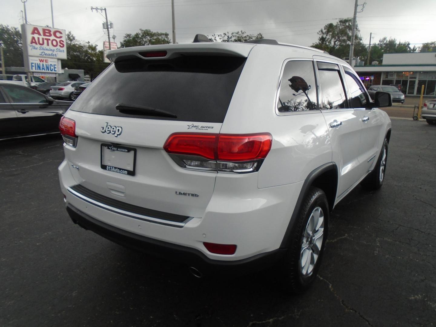 2014 Jeep Grand Cherokee Limited 4WD (1C4RJFBG5EC) with an 3.6L V6 DOHC 24V engine, 5-Speed Automatic transmission, located at 6112 N Florida Avenue, Tampa, FL, 33604, (888) 521-5131, 27.954929, -82.459534 - Photo#3