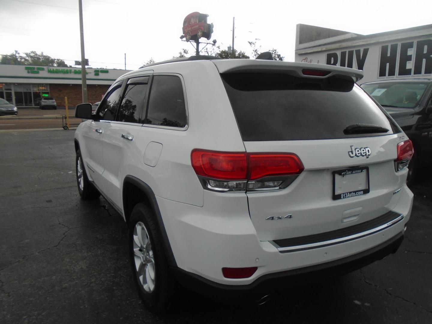 2014 Jeep Grand Cherokee Limited 4WD (1C4RJFBG5EC) with an 3.6L V6 DOHC 24V engine, 5-Speed Automatic transmission, located at 6112 N Florida Avenue, Tampa, FL, 33604, (888) 521-5131, 27.954929, -82.459534 - Photo#5