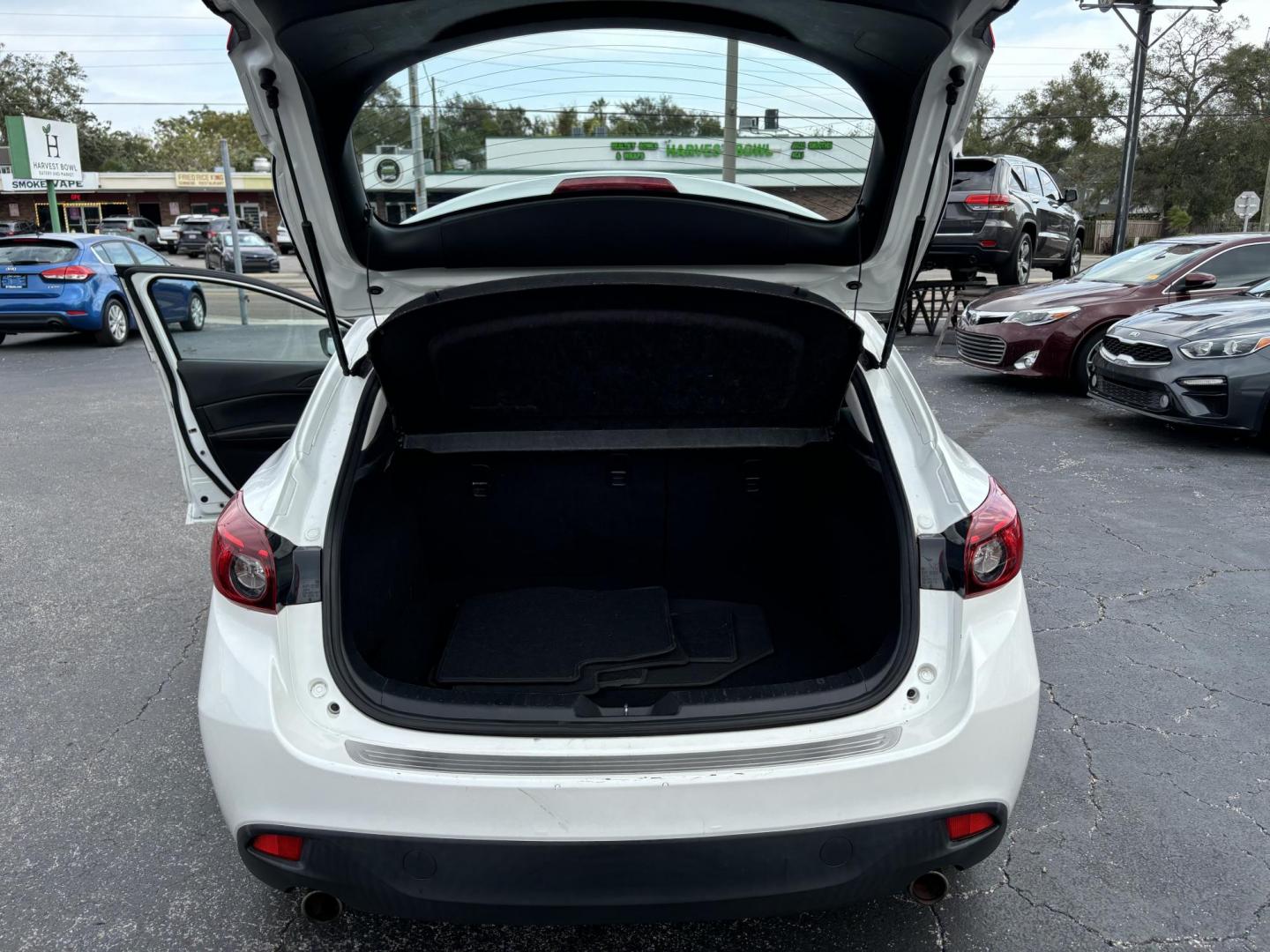 2015 Mazda MAZDA3 s Touring AT 5-Door (JM1BM1L34F1) with an 2.5L L4 DOHC 16V engine, 6-Speed Automatic transmission, located at 6112 N Florida Avenue, Tampa, FL, 33604, (888) 521-5131, 27.954929, -82.459534 - Photo#5