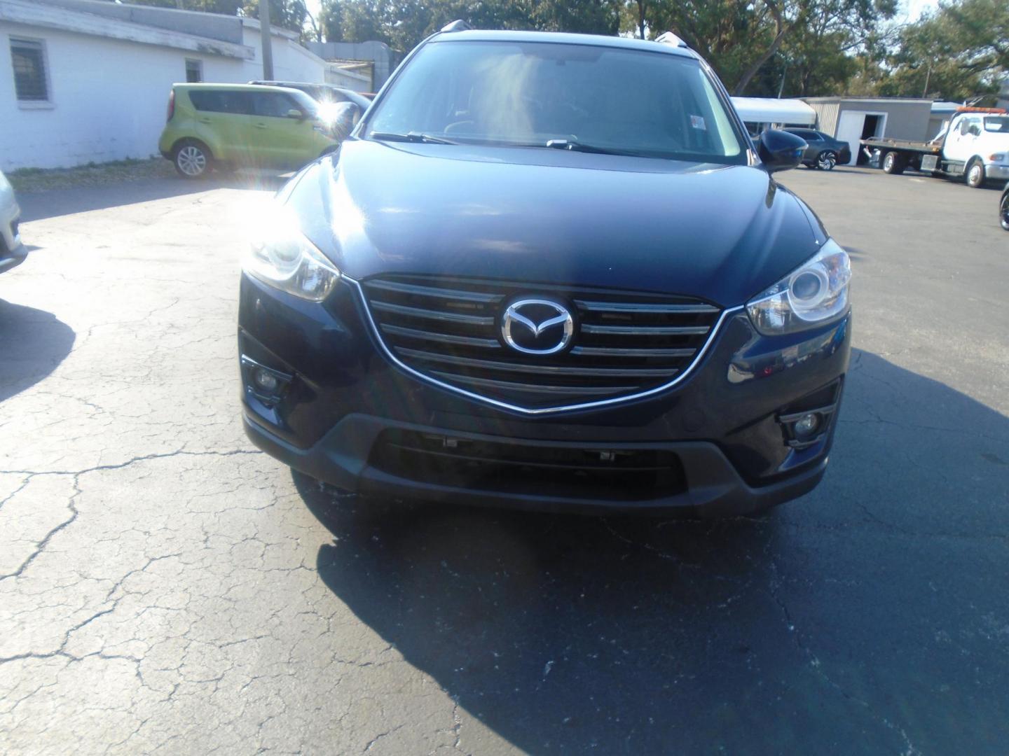 2016 Mazda CX-5 Touring (JM3KE2CYXG0) with an 2.5L L4 DOHC 16V engine, 6-Speed Automatic transmission, located at 6112 N Florida Avenue, Tampa, FL, 33604, (888) 521-5131, 27.954929, -82.459534 - Photo#1