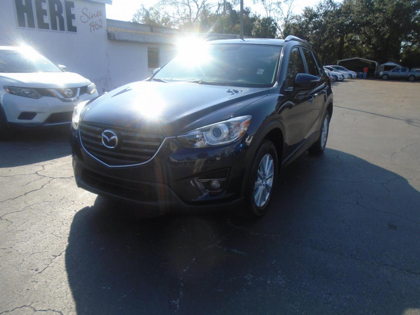 2016 Mazda CX-5 Touring (JM3KE2CYXG0) with an 2.5L L4 DOHC 16V engine, 6-Speed Automatic transmission, located at 6112 N Florida Avenue, Tampa, FL, 33604, (888) 521-5131, 27.954929, -82.459534 - Photo#2