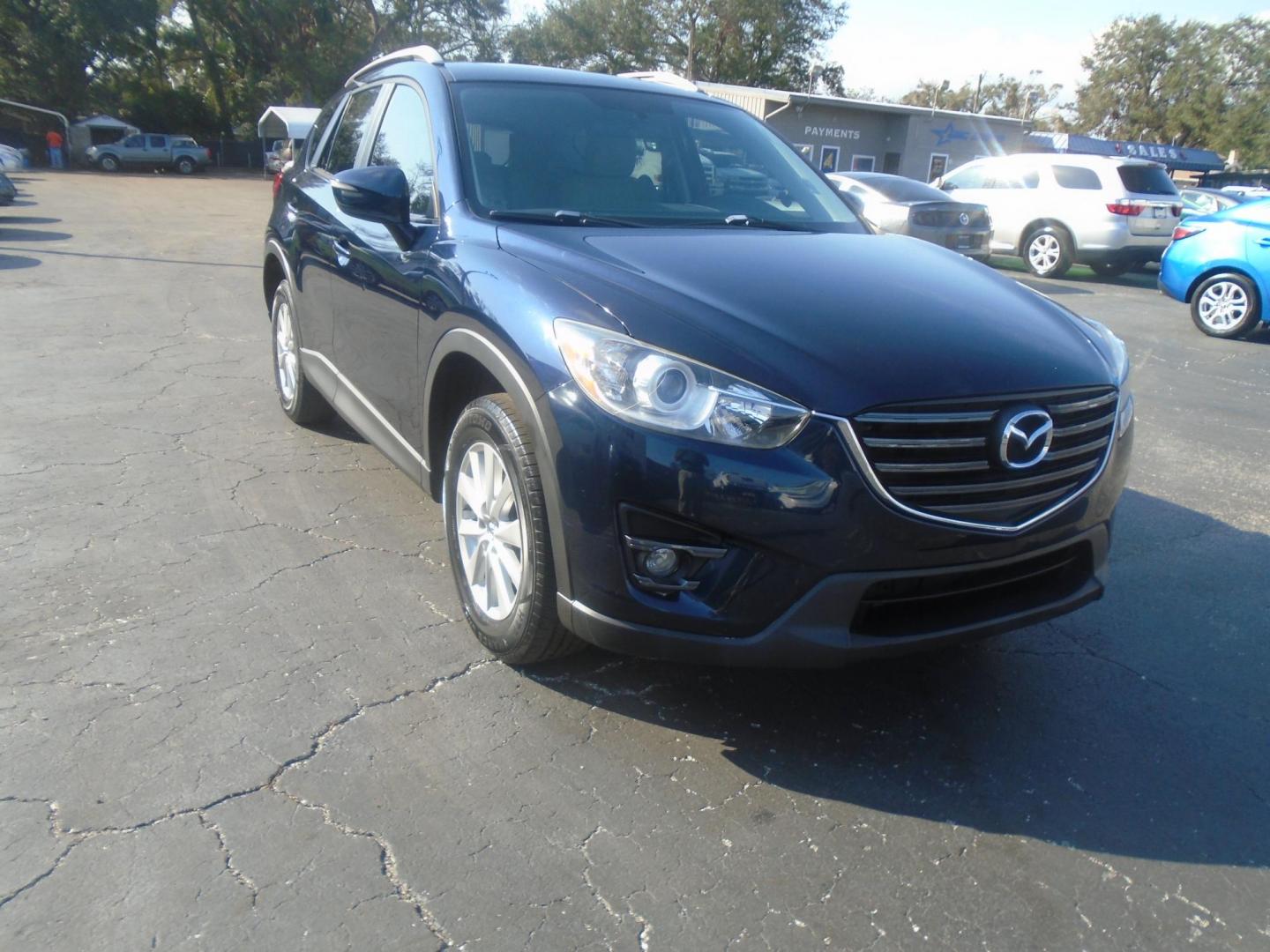 2016 Mazda CX-5 Touring (JM3KE2CYXG0) with an 2.5L L4 DOHC 16V engine, 6-Speed Automatic transmission, located at 6112 N Florida Avenue, Tampa, FL, 33604, (888) 521-5131, 27.954929, -82.459534 - Photo#3