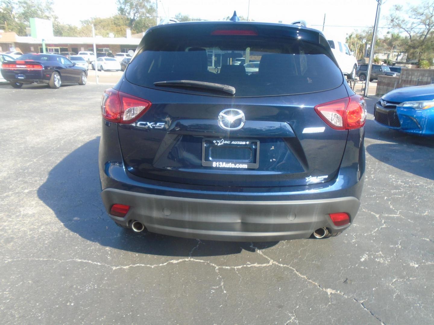 2016 Mazda CX-5 Touring (JM3KE2CYXG0) with an 2.5L L4 DOHC 16V engine, 6-Speed Automatic transmission, located at 6112 N Florida Avenue, Tampa, FL, 33604, (888) 521-5131, 27.954929, -82.459534 - Photo#4