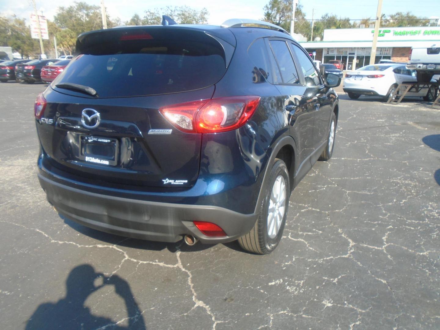 2016 Mazda CX-5 Touring (JM3KE2CYXG0) with an 2.5L L4 DOHC 16V engine, 6-Speed Automatic transmission, located at 6112 N Florida Avenue, Tampa, FL, 33604, (888) 521-5131, 27.954929, -82.459534 - Photo#5