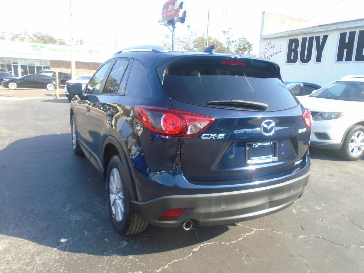 2016 Mazda CX-5 Touring (JM3KE2CYXG0) with an 2.5L L4 DOHC 16V engine, 6-Speed Automatic transmission, located at 6112 N Florida Avenue, Tampa, FL, 33604, (888) 521-5131, 27.954929, -82.459534 - Photo#6