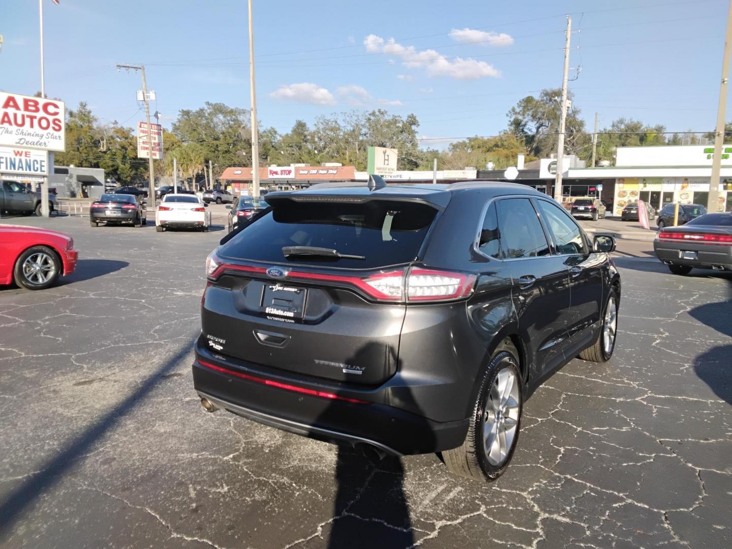 2018 GRAY /Black Ford Edge Titanium (2FMPK3K98JB) with an 2.0L L4 DOHC 16V engine, 6A transmission, located at 6112 N Florida Avenue, Tampa, FL, 33604, (888) 521-5131, 27.954929, -82.459534 - $499 down plus tax & tag. - Photo#4