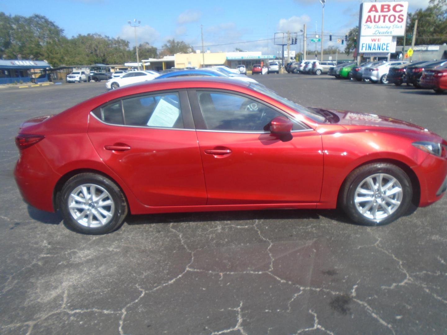 2015 Mazda MAZDA3 i Touring AT 4-Door (3MZBM1V74FM) with an 2.0L L4 DOHC 16V engine, 6-Speed Automatic transmission, located at 6112 N Florida Avenue, Tampa, FL, 33604, (888) 521-5131, 27.954929, -82.459534 - Photo#4