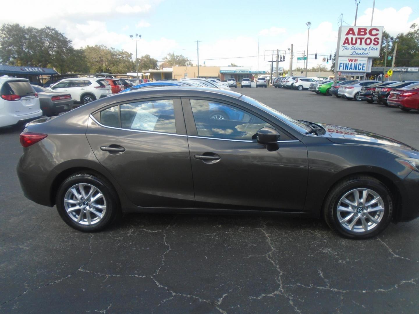 2014 Mazda MAZDA3 i Grand Touring AT 4-Door (JM1BM1W75E1) with an 2.0L L4 DOHC 16V engine, 6-Speed Automatic transmission, located at 6112 N Florida Avenue, Tampa, FL, 33604, (888) 521-5131, 27.954929, -82.459534 - Photo#5