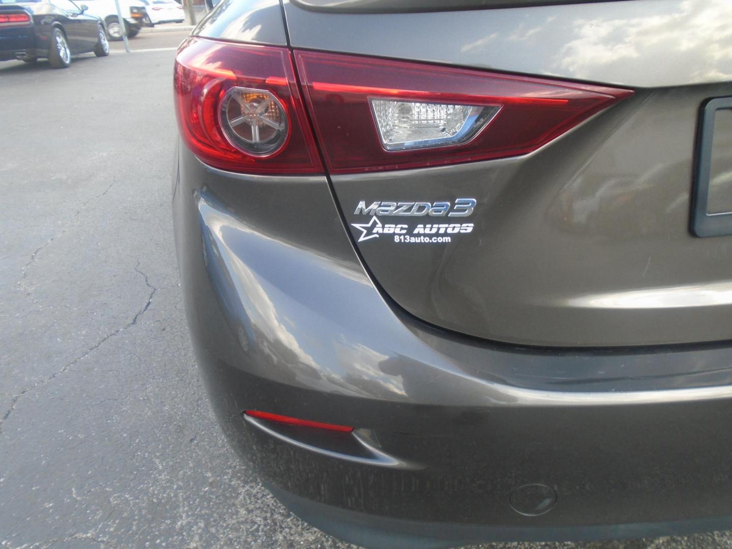 2014 Mazda MAZDA3 i Grand Touring AT 4-Door (JM1BM1W75E1) with an 2.0L L4 DOHC 16V engine, 6-Speed Automatic transmission, located at 6112 N Florida Avenue, Tampa, FL, 33604, (888) 521-5131, 27.954929, -82.459534 - Photo#10