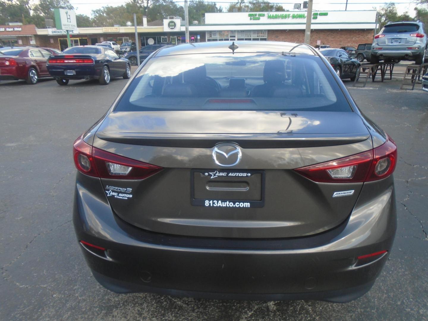 2014 Mazda MAZDA3 i Grand Touring AT 4-Door (JM1BM1W75E1) with an 2.0L L4 DOHC 16V engine, 6-Speed Automatic transmission, located at 6112 N Florida Avenue, Tampa, FL, 33604, (888) 521-5131, 27.954929, -82.459534 - Photo#7