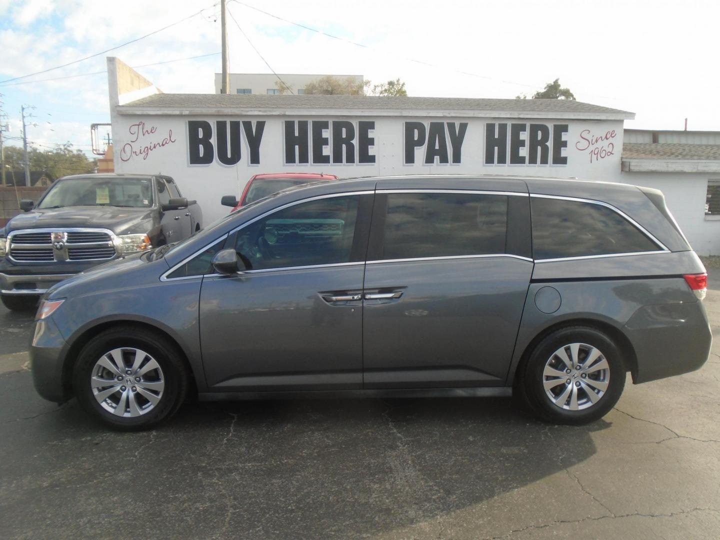 2014 Honda Odyssey EX-L (5FNRL5H62EB) with an 3.5L V6 SOHC 24V engine, 6-Speed Automatic transmission, located at 6112 N Florida Avenue, Tampa, FL, 33604, (888) 521-5131, 27.954929, -82.459534 - Photo#0