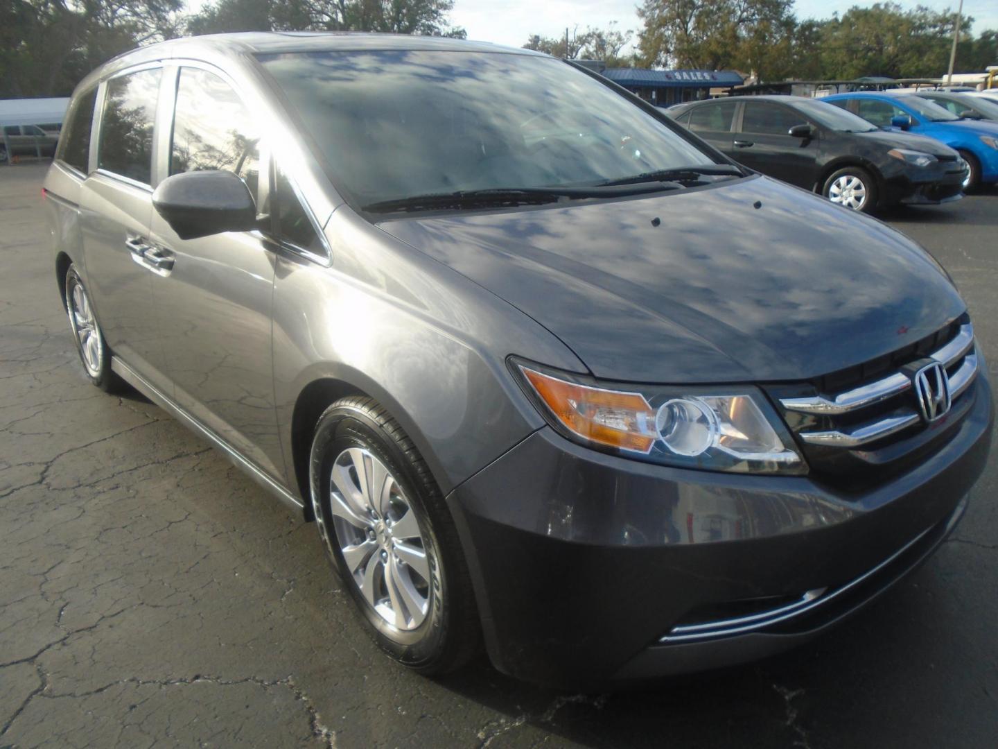 2014 Honda Odyssey EX-L (5FNRL5H62EB) with an 3.5L V6 SOHC 24V engine, 6-Speed Automatic transmission, located at 6112 N Florida Avenue, Tampa, FL, 33604, (888) 521-5131, 27.954929, -82.459534 - Photo#1