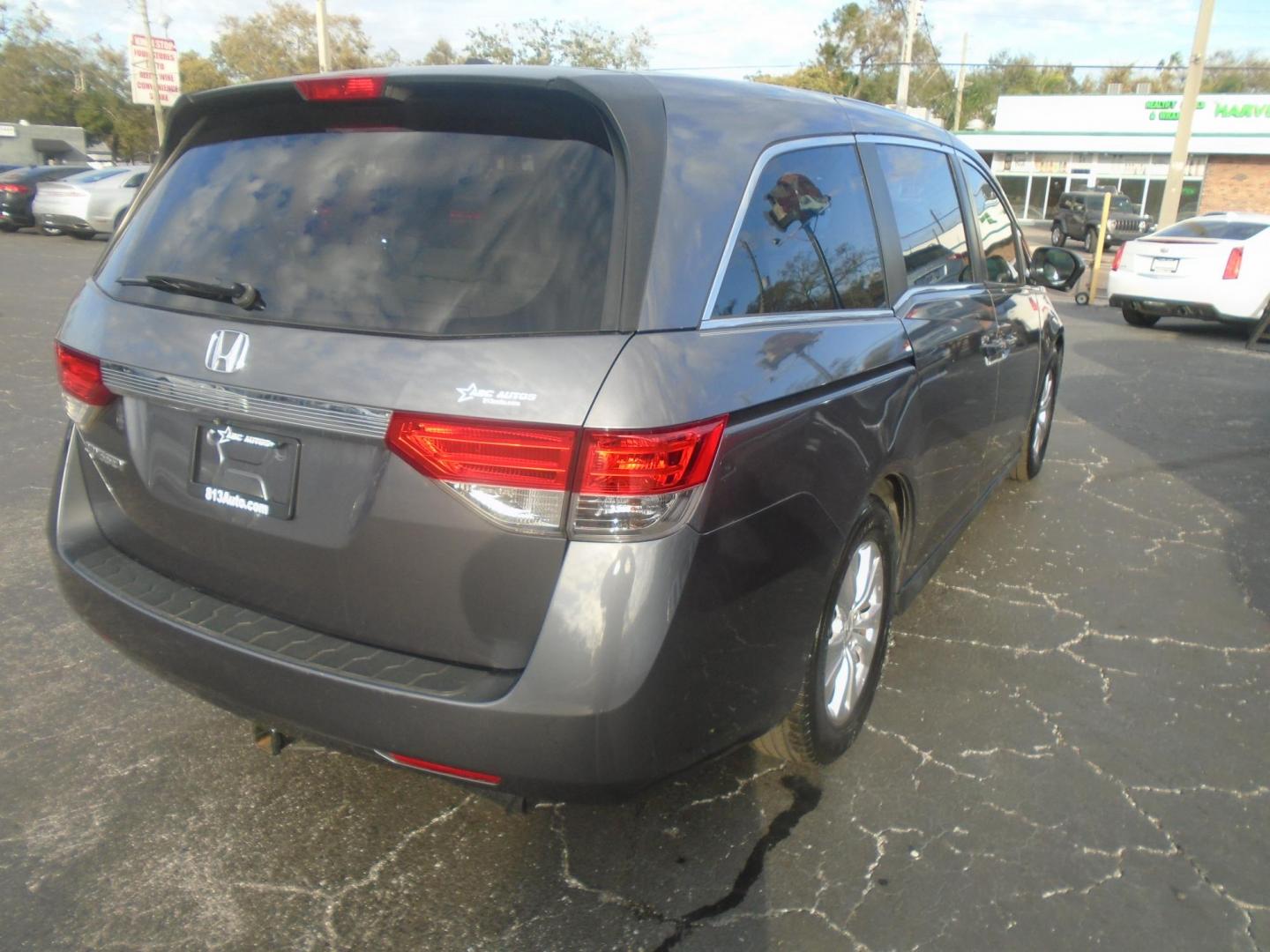 2014 Honda Odyssey EX-L (5FNRL5H62EB) with an 3.5L V6 SOHC 24V engine, 6-Speed Automatic transmission, located at 6112 N Florida Avenue, Tampa, FL, 33604, (888) 521-5131, 27.954929, -82.459534 - Photo#3