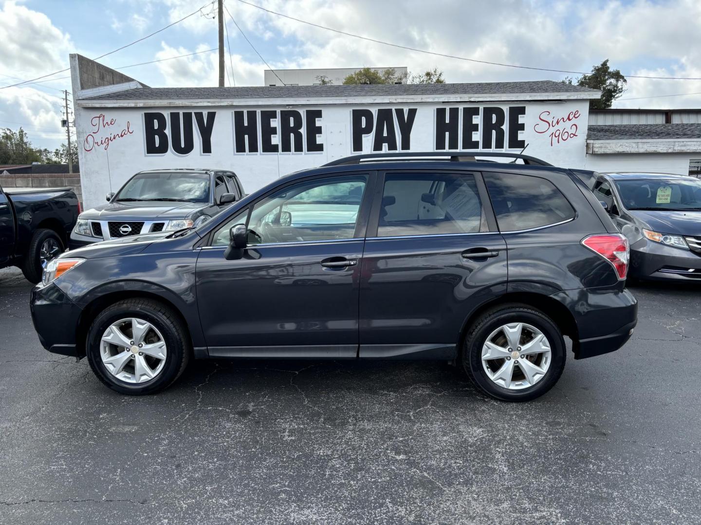 2015 Subaru Forester 2.5i Limited (JF2SJAHC5FH) with an 2.5L H4 SOHC 16V engine, 6-Speed Automatic transmission, located at 6112 N Florida Avenue, Tampa, FL, 33604, (888) 521-5131, 27.954929, -82.459534 - Photo#0