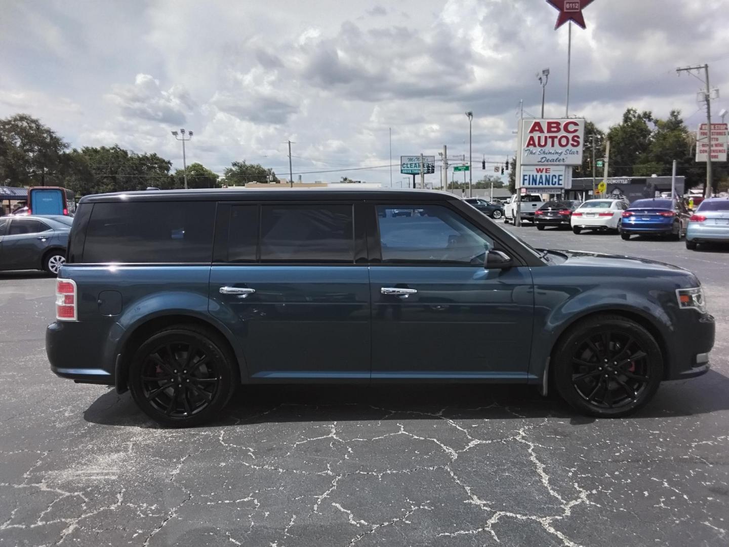 2016 BLUE /Grey Ford Flex Limited AWD w/EcoBoost (2FMHK6DT8GB) with an 3.5L V6 DOHC 24V engine, 6A transmission, located at 6112 N Florida Avenue, Tampa, FL, 33604, (888) 521-5131, 27.954929, -82.459534 - $499 DOWN PLUS TAX & TAG. - Photo#1