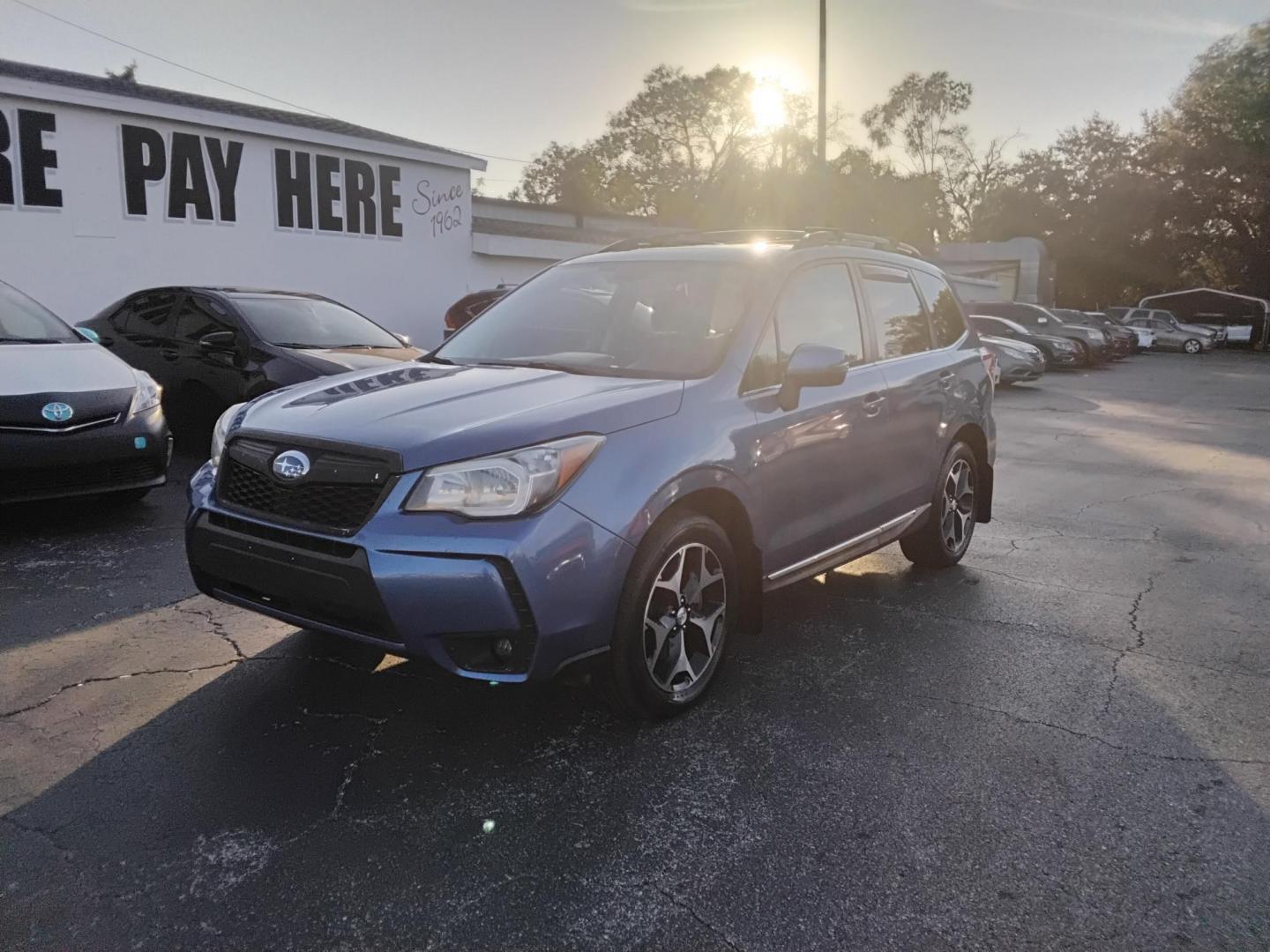 2015 BLUE /Grey Subaru Forester 2.0XT Touring (JF2SJGWC2FH) with an 2.0L H4 SOHC 16V engine, 6-Speed Automatic transmission, located at 6112 N Florida Avenue, Tampa, FL, 33604, (888) 521-5131, 27.954929, -82.459534 - $499 down plus tax & tag. - Photo#1