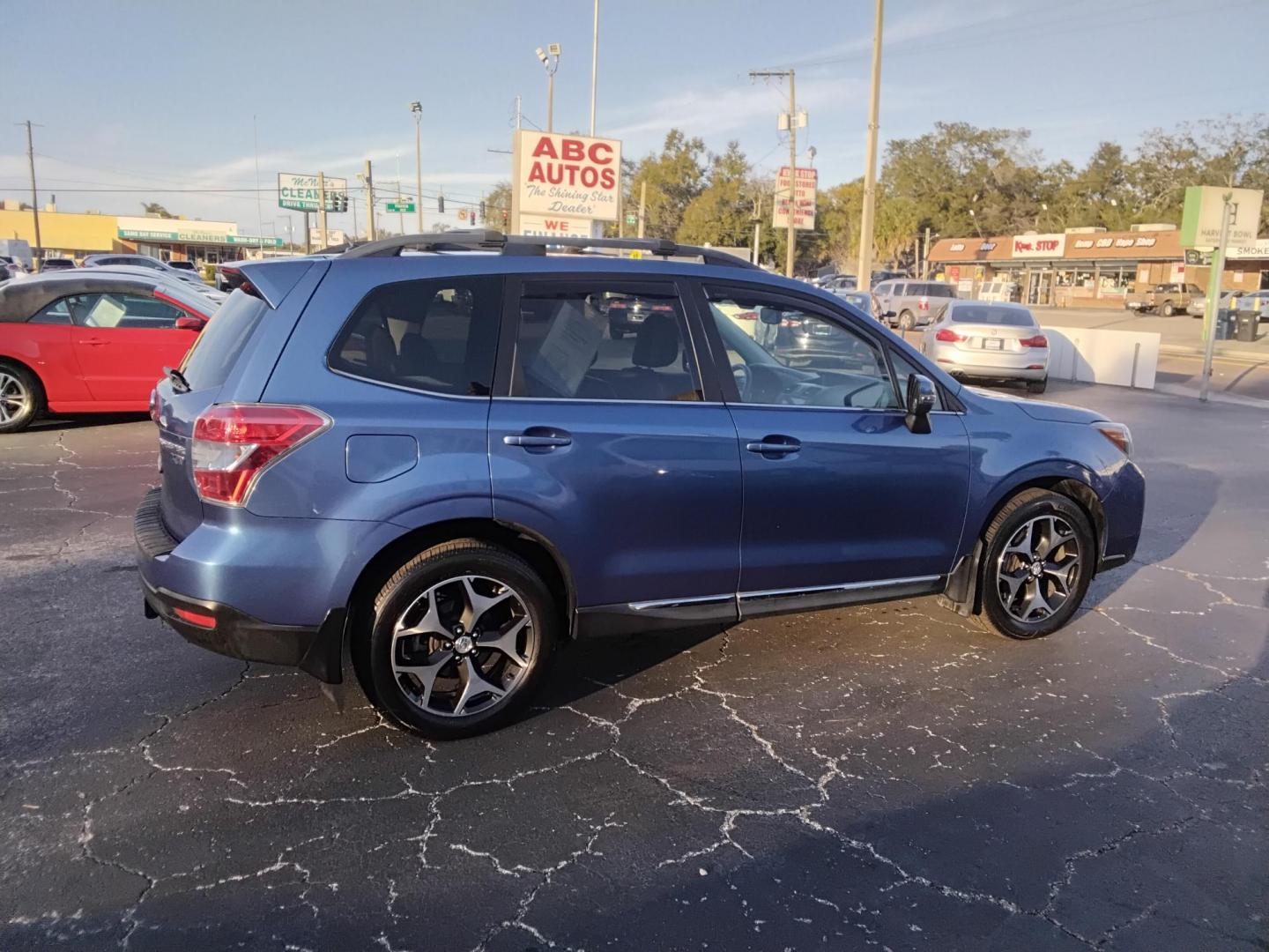 2015 BLUE /Grey Subaru Forester 2.0XT Touring (JF2SJGWC2FH) with an 2.0L H4 SOHC 16V engine, 6-Speed Automatic transmission, located at 6112 N Florida Avenue, Tampa, FL, 33604, (888) 521-5131, 27.954929, -82.459534 - $499 down plus tax & tag. - Photo#4