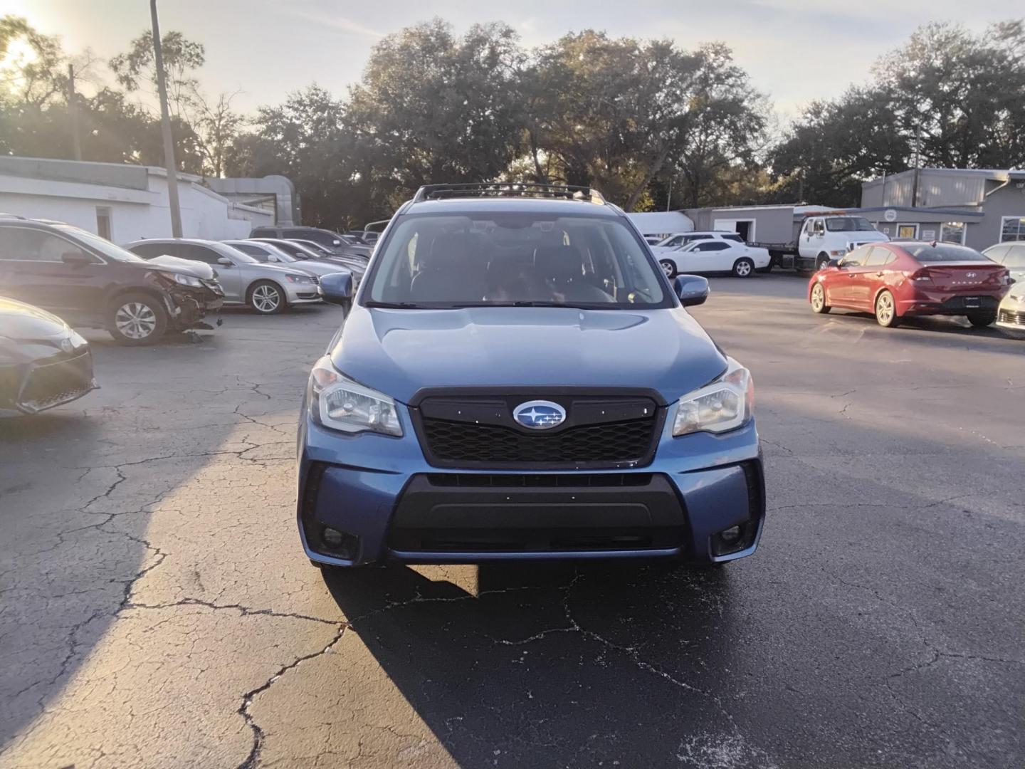 2015 BLUE /Grey Subaru Forester 2.0XT Touring (JF2SJGWC2FH) with an 2.0L H4 SOHC 16V engine, 6-Speed Automatic transmission, located at 6112 N Florida Avenue, Tampa, FL, 33604, (888) 521-5131, 27.954929, -82.459534 - $499 down plus tax & tag. - Photo#2