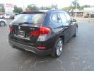2014 BMW X1 xDrive28i (WBAVL1C55EV) with an 2.0L L4 DOHC 16V engine, 8-Speed Automatic transmission, located at 6112 N Florida Avenue, Tampa, FL, 33604, (888) 521-5131, 27.954929, -82.459534 - Photo#5